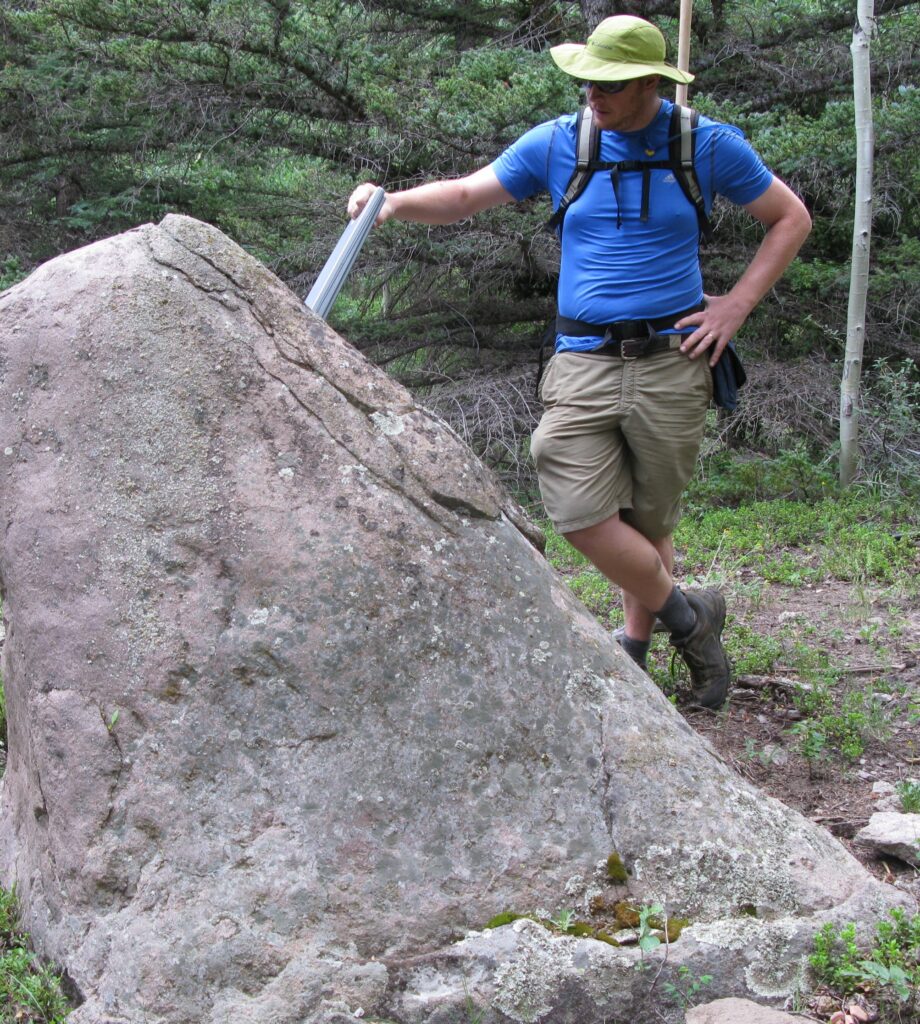 BGJ in field examining a rock